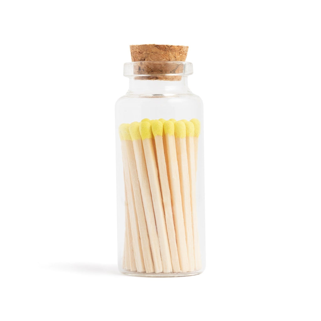 lemon yellow color tip wood matchsticks in corked jar with match striker