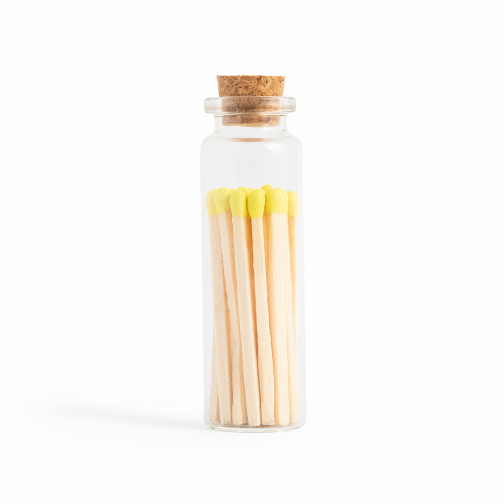 lemon yellow color tip wood matches in corked jar with match striker