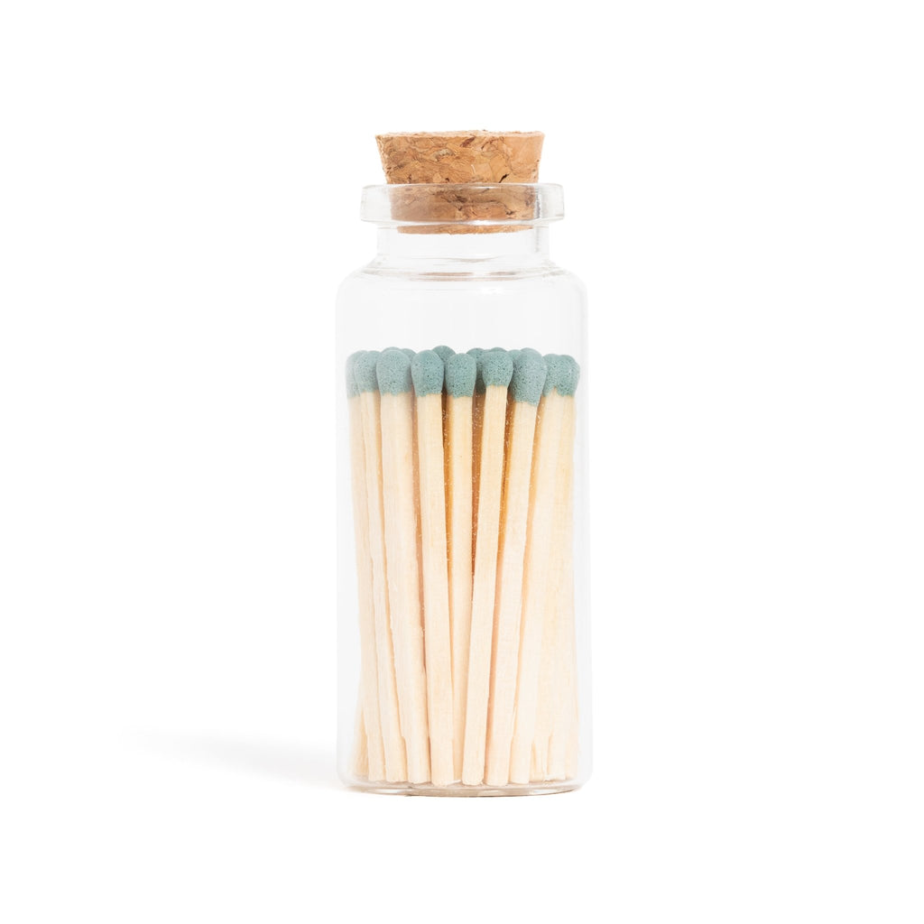 green sage color tip wood matchsticks in corked jar with match striker