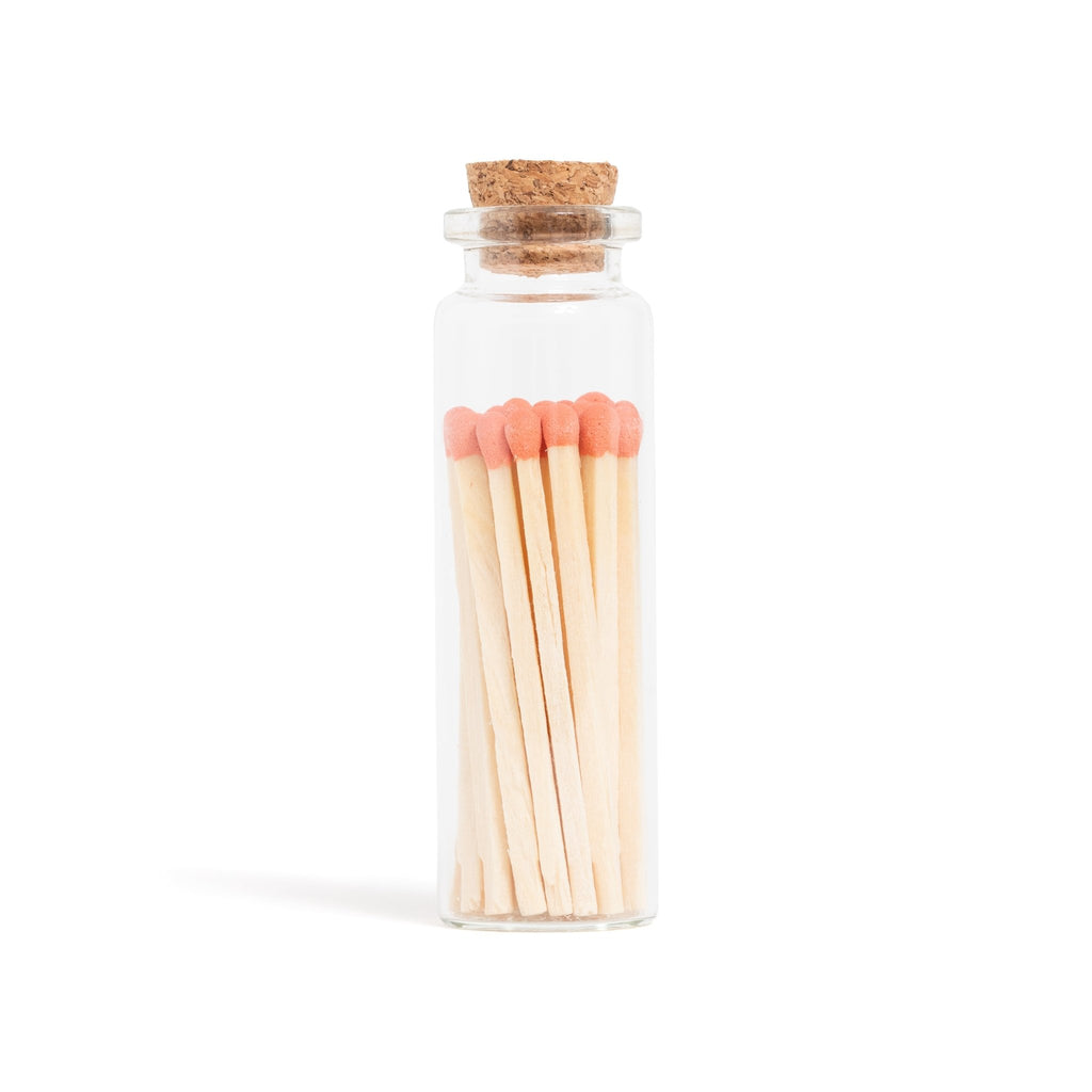 tangerine orange color tip wood matches in corked jar with match striker