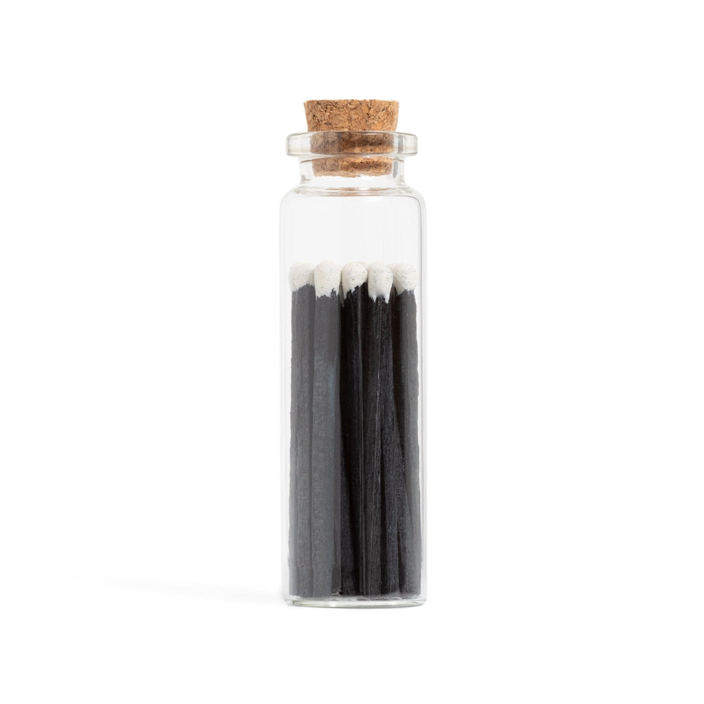 tuxedo black and white color tip wood matches in corked jar with match striker